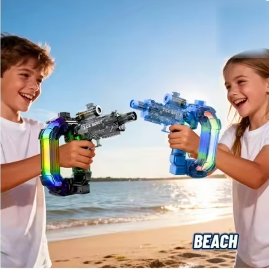 Kids enjoying beach with a water blaster